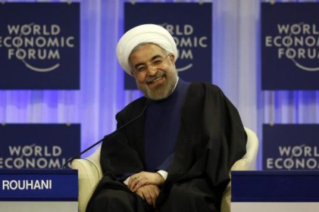 Iran's President Rouhani smiles during session of World Economic Forum in Davos
